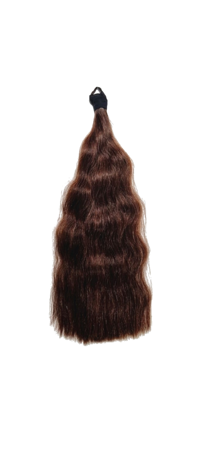 Brown hair extension with a black clip on a white background